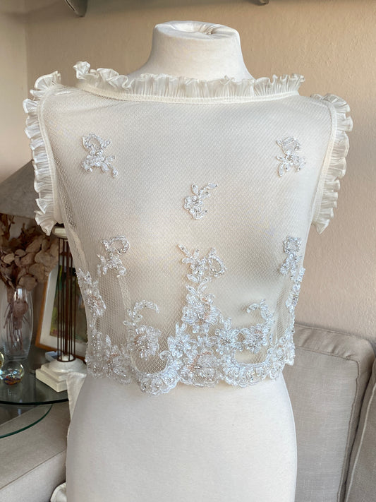 Top de tul transparente con bordado floral